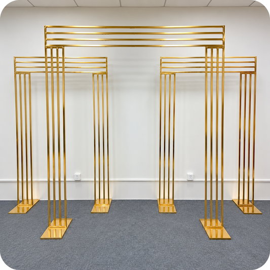 Three-piece gold metal wedding arch backdrop set featuring one large centre arch and two smaller matching rectangular arches for wedding and event rentals in Ottawa.