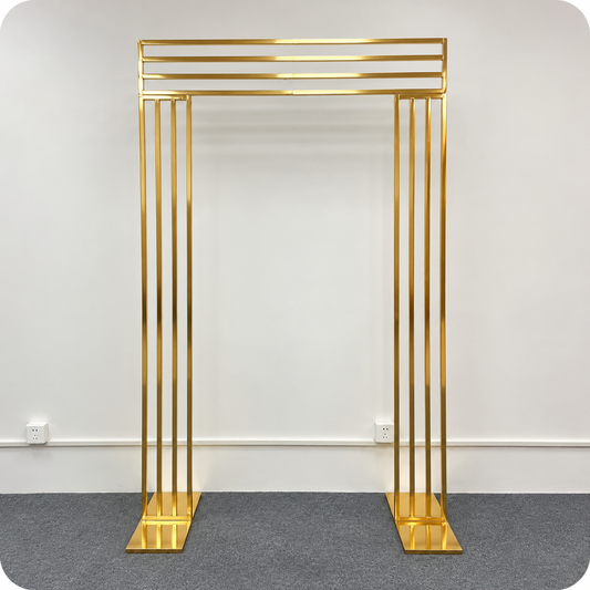 Small gold metal wedding arch backdrop frame, 2 m tall and 1.4 m wide, available for event rentals in Ottawa
