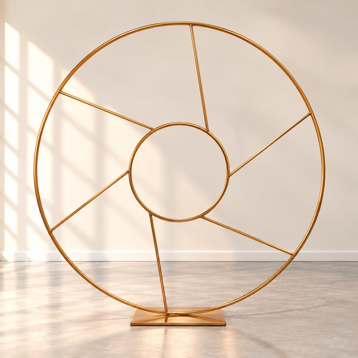 Gold stainless steel circle backdrop rental in Ottawa featuring a 2 m round metal frame with an inner circle and geometric detailing for weddings and special events.