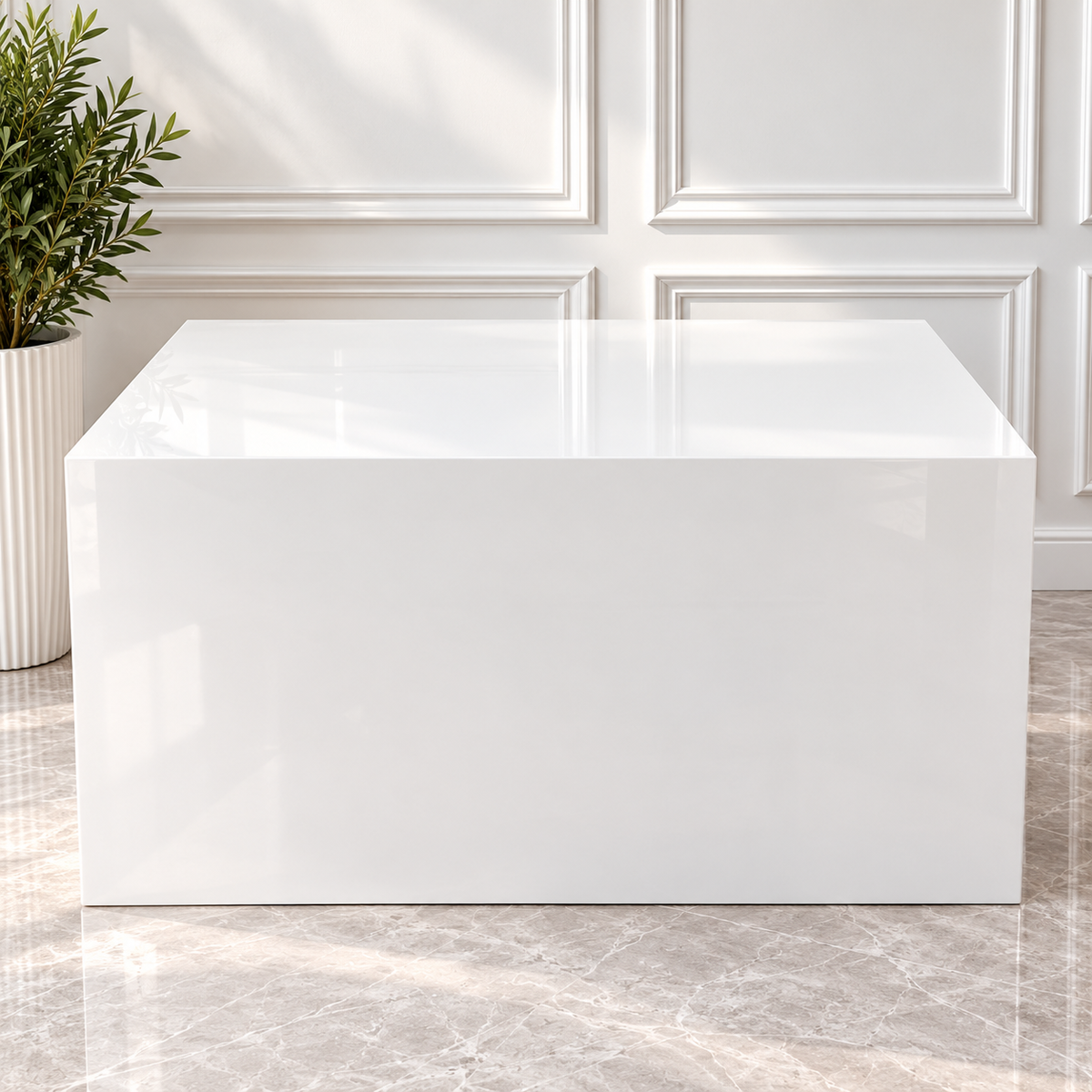 Glossy white acrylic cake table with a rectangular tabletop and solid white front panel, available for wedding and event rentals in Ottawa.