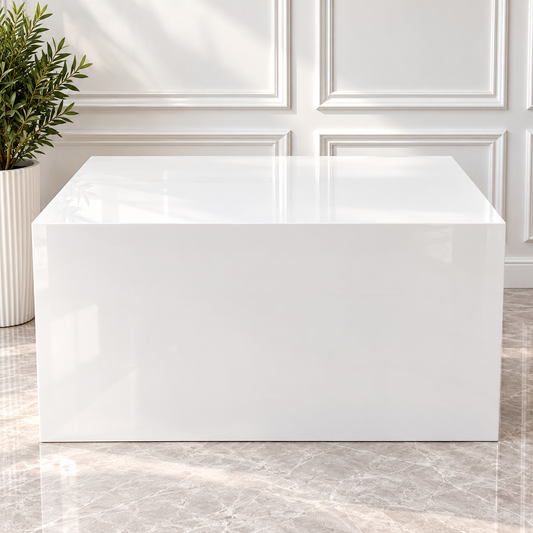 Glossy white acrylic cake table with a rectangular tabletop and solid white front panel, available for wedding and event rentals in Ottawa.
